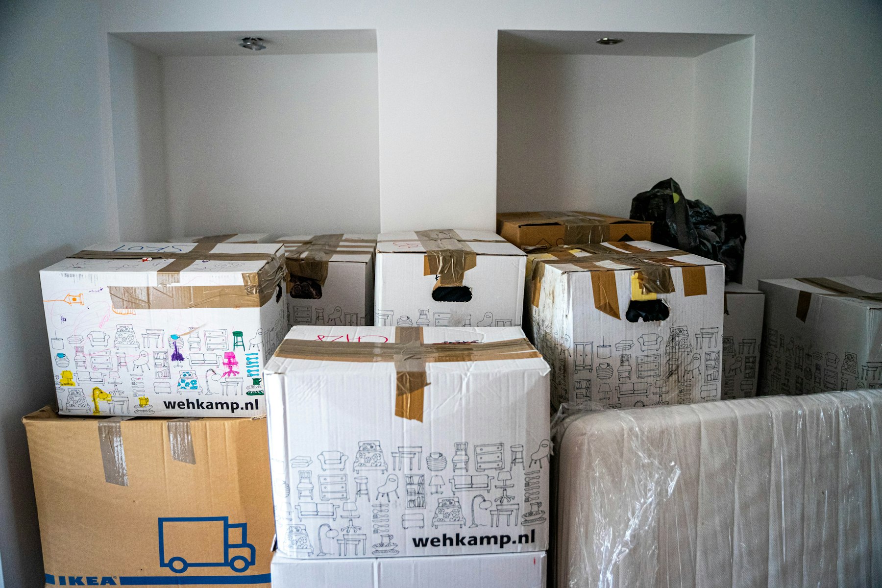 Cardboard boxes stacked on a table ready to ship