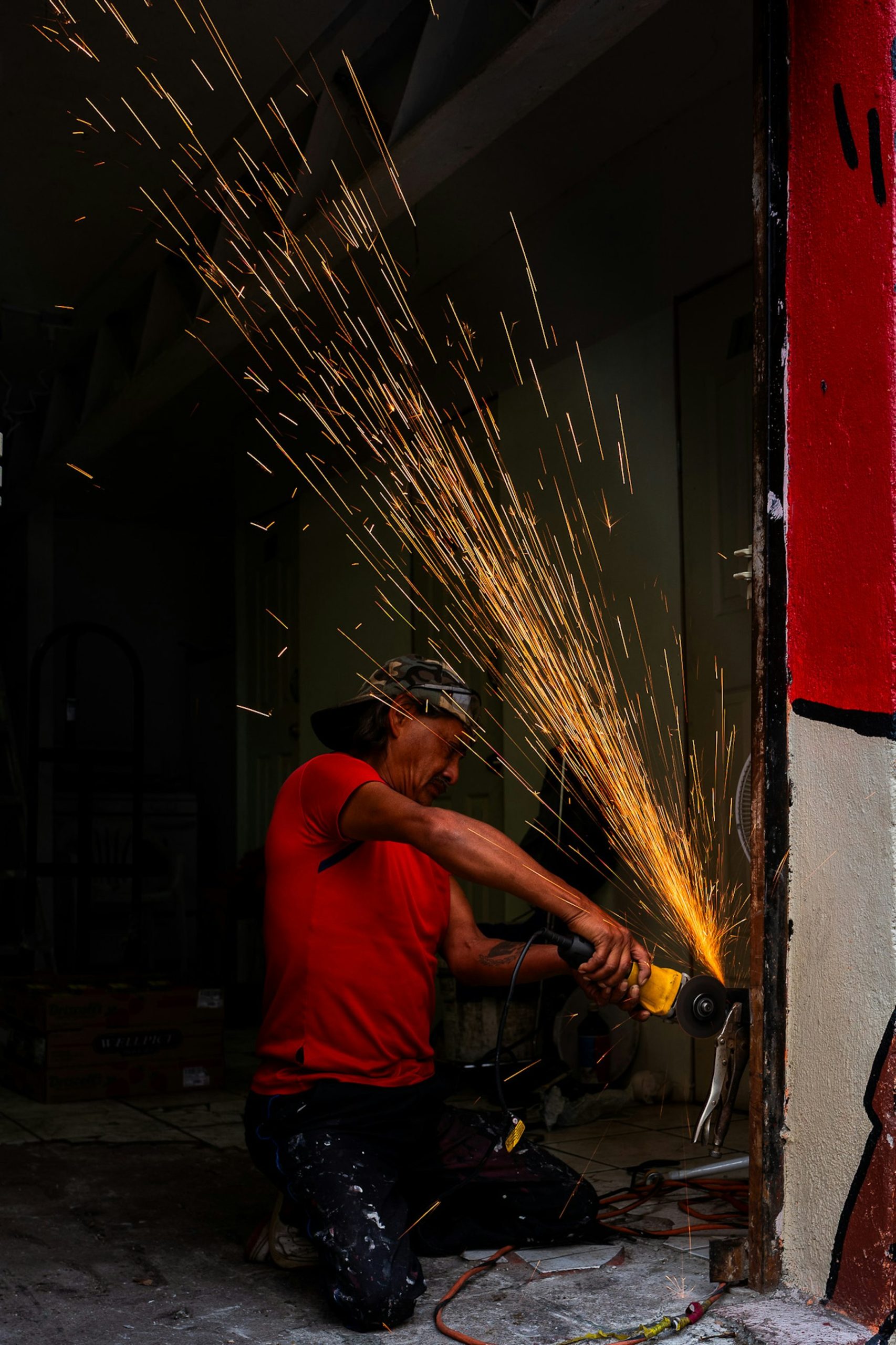 Angle grinder throwing sparks in a workshop