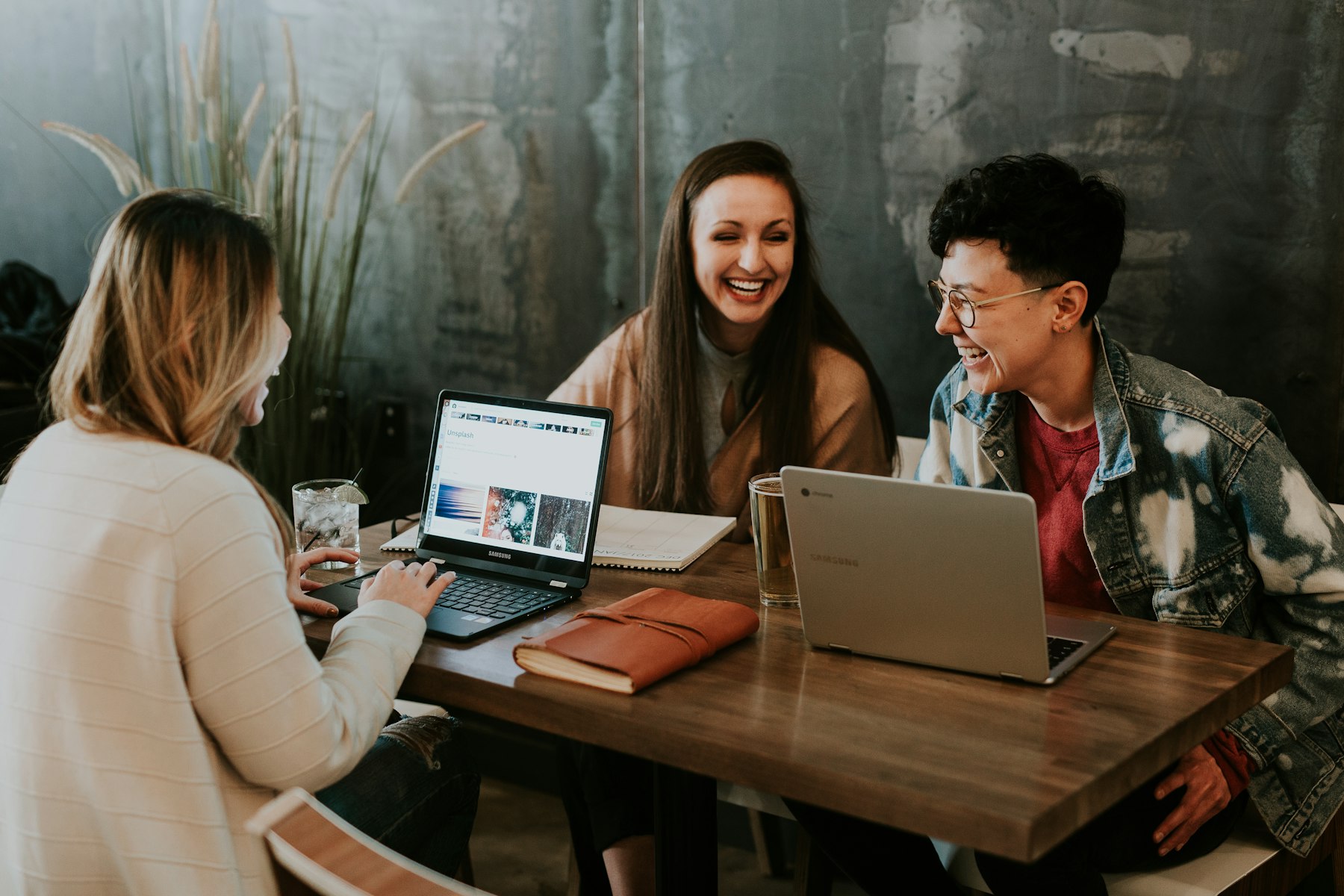 Small team looking at a laptop together