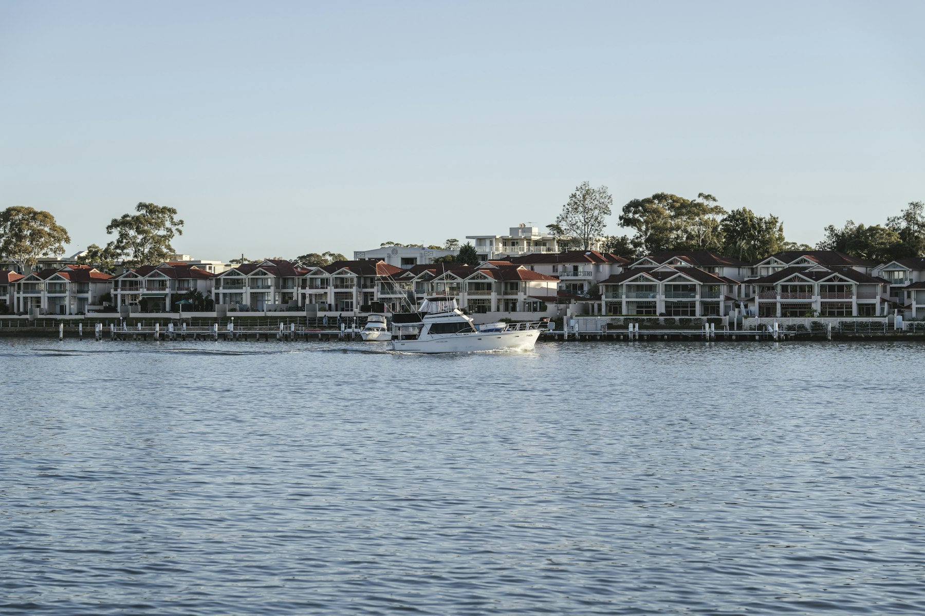 Houses along the edge of calm water