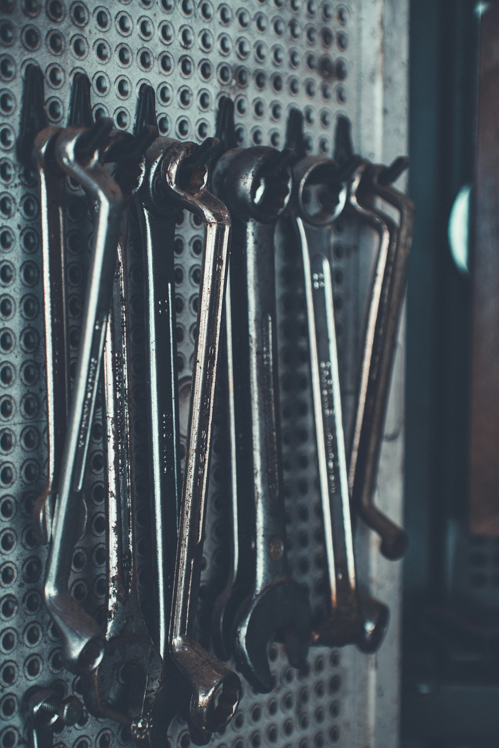 Set of wrenches hanging on a workshop wall